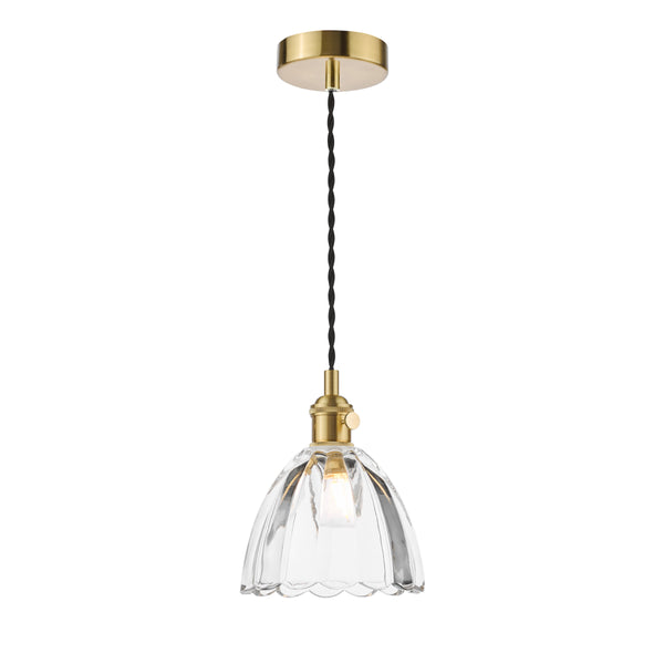 A brass ceiling pendant with a clear, fluted glass shade and a visible light bulb.