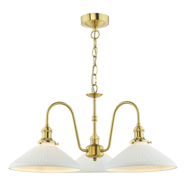 Brass chandelier with three white, ribbed, cone-shaped shades, hanging from a chain.