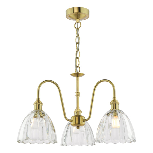A three-light brass chandelier with clear, fluted glass shades.