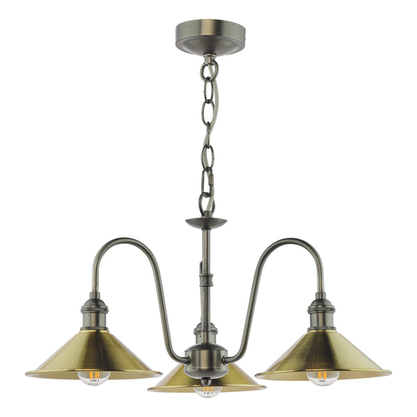 Antique brass chandelier with three downward-facing, cone-shaped shades and exposed filament bulbs.