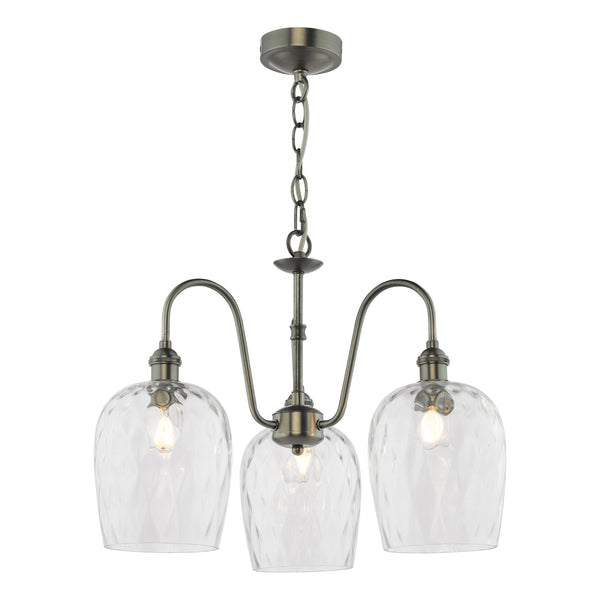 Three-light chandelier with clear, textured glass shades and an antique brass finish.