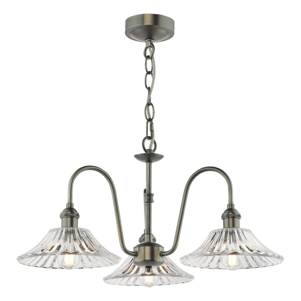 Antique brass chandelier with three ribbed glass shades and exposed bulbs.