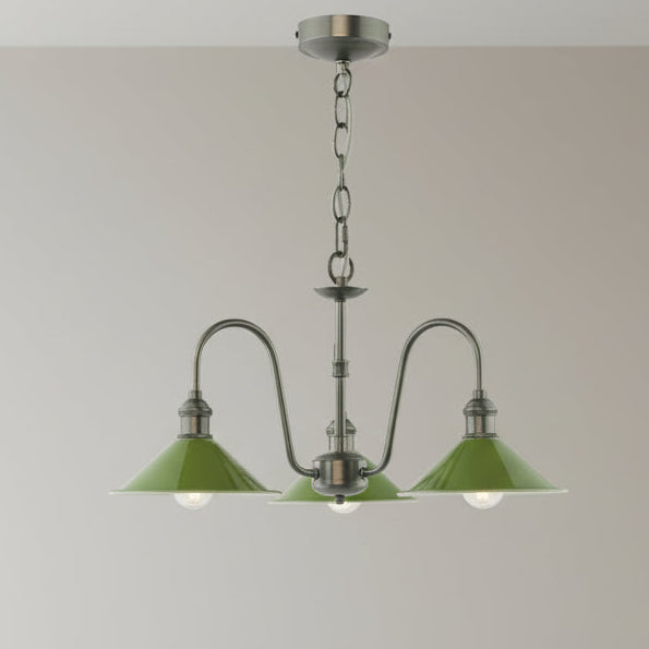 A three-arm chandelier with green metal shades and exposed bulbs, featuring an antique brass finish.
