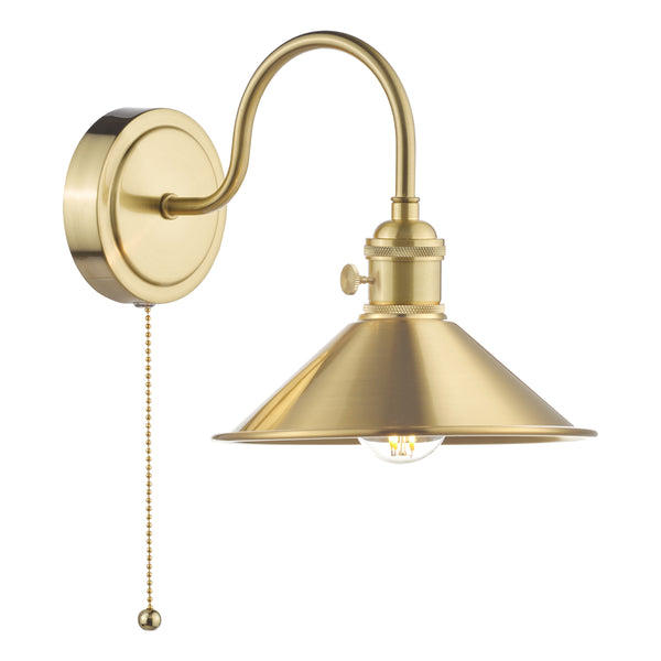 Brass wall sconce with a curved arm, conical shade, exposed bulb, and a pull chain switch.
