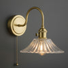 Hadano Switched Wall Light In Natural Brass with Clear Flared Glass Shade