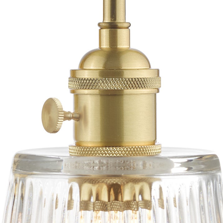 Hadano Switched Wall Light In Natural Brass with Clear Ribbed Glass Shade