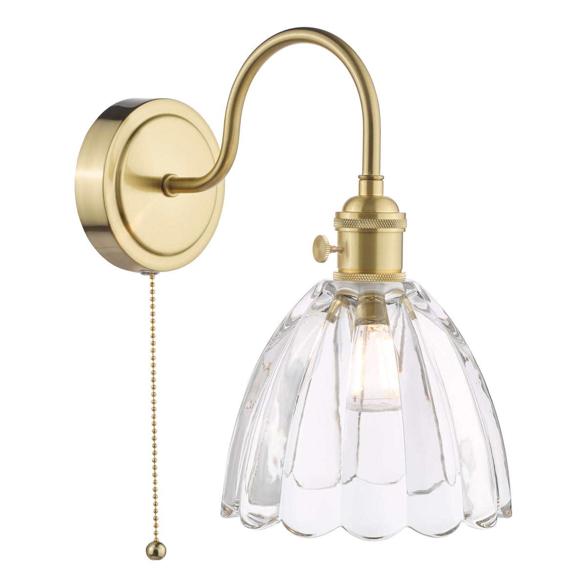 Brass wall sconce with a clear, fluted glass shade and a pull chain switch. The light is on.