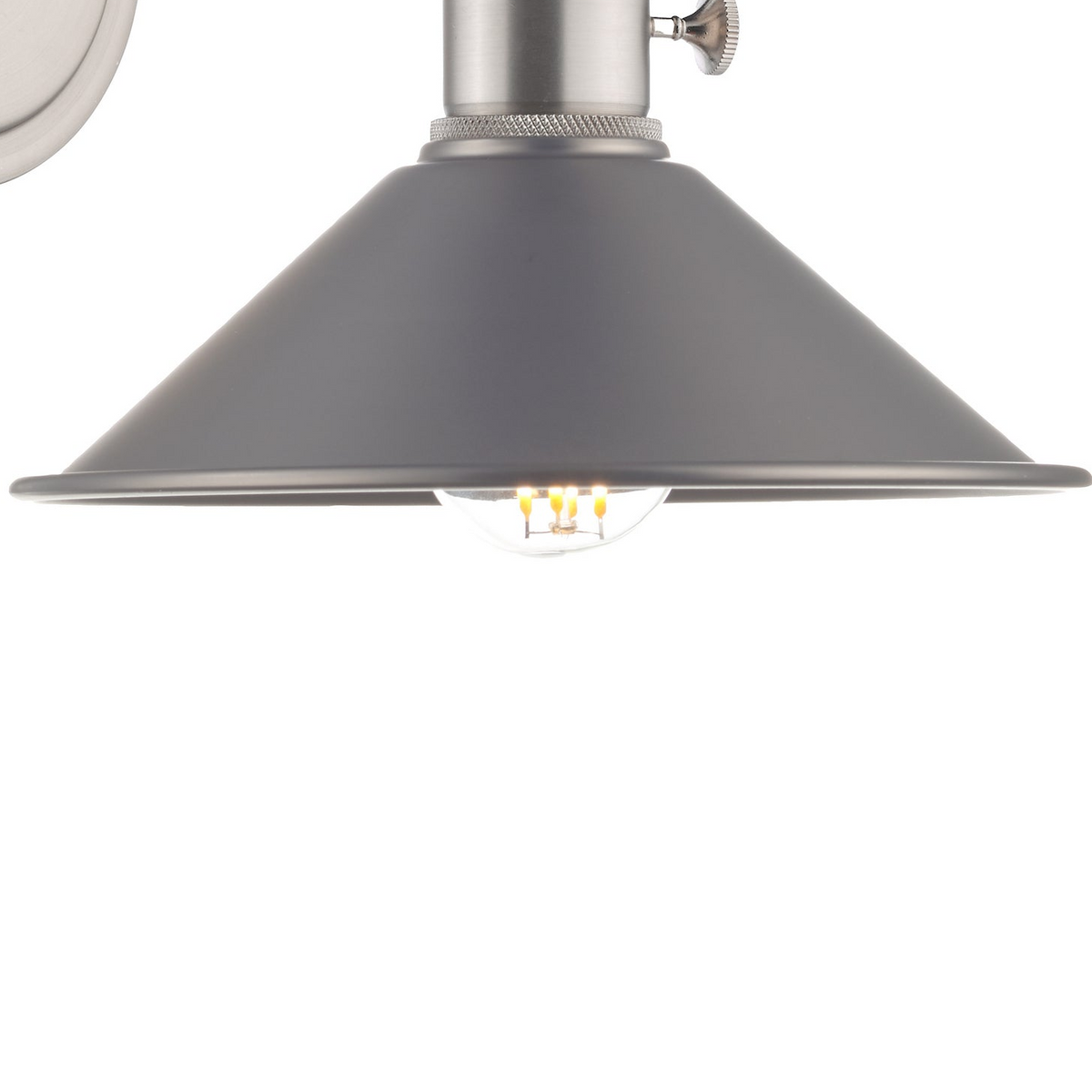 Close up of a grey metal lampshade with a clear lightbulb showing glowing filaments
