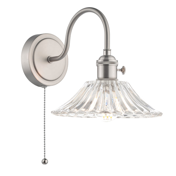Brushed nickel wall sconce with a clear, fluted glass shade and a pull chain switch. 