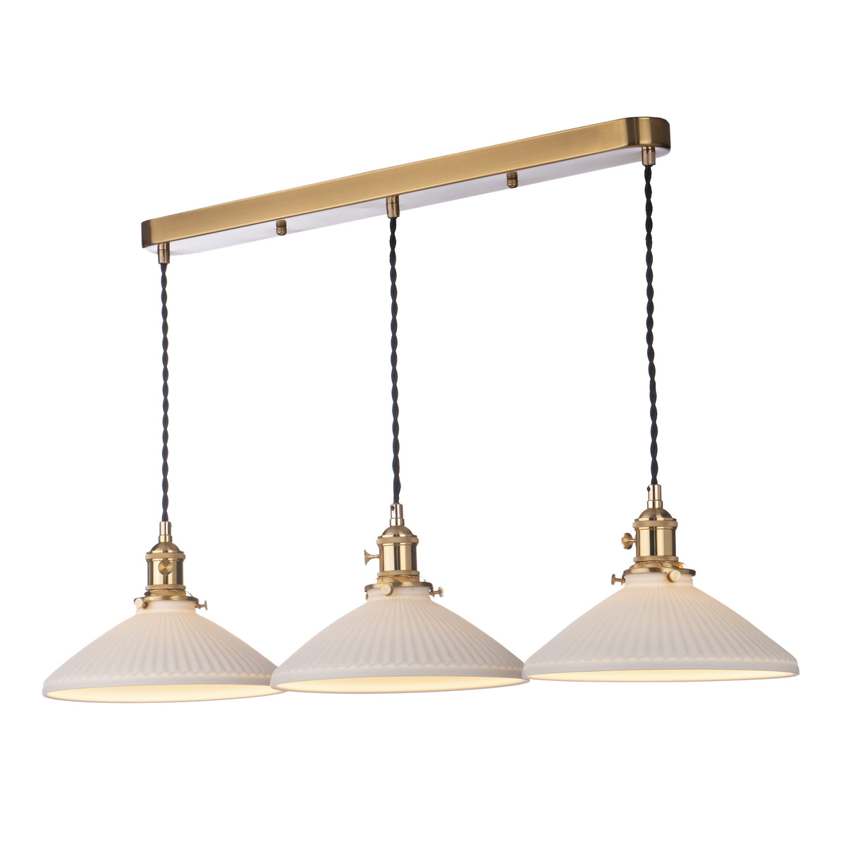 Three white fluted pendant lights with brass accents hang from a rectangular brass bar.