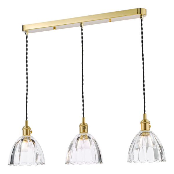 Three clear fluted glass pendant lights hang from a gold bar, with black twisted cords.