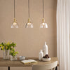 Hadano Triple Drop Linear Bar Pendant In Natural Brass with Scalloped Bell Glass Shades