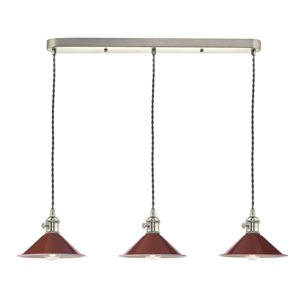 Three red pendant lights with brushed nickel hardware and twisted cords hang from a rectangular ceiling plate. 