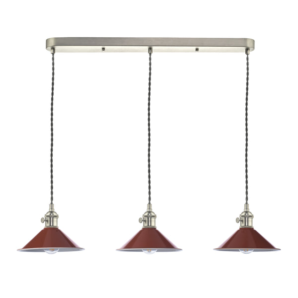 Three red pendant lights with twisted cords hang from a brushed metal bar. Each light has a clear bulb.