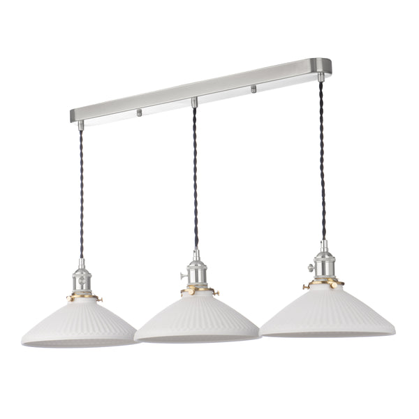 Three white fluted pendant lights hang from a brushed nickel bar. Each light has a black twisted cord.