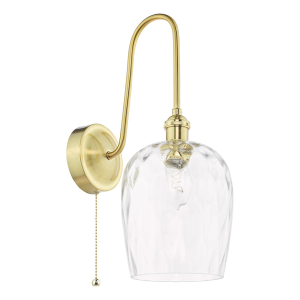 Brass wall sconce with a curved arm, a clear textured glass shade, and a pull chain switch.