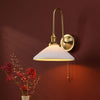 Hadano Tall Switched Wall Light In Natural Brass with White Shallow Ceramic Shade