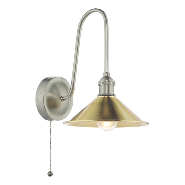 Brushed antique brass wall light with a curved arm and a conical shade, featuring a pull chain switch.
