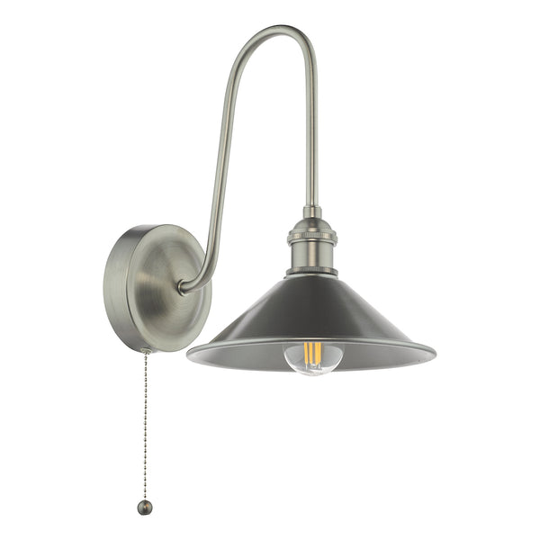 Brushed nickel wall sconce with a curved arm, a cone-shaped shade, and a pull chain switch.