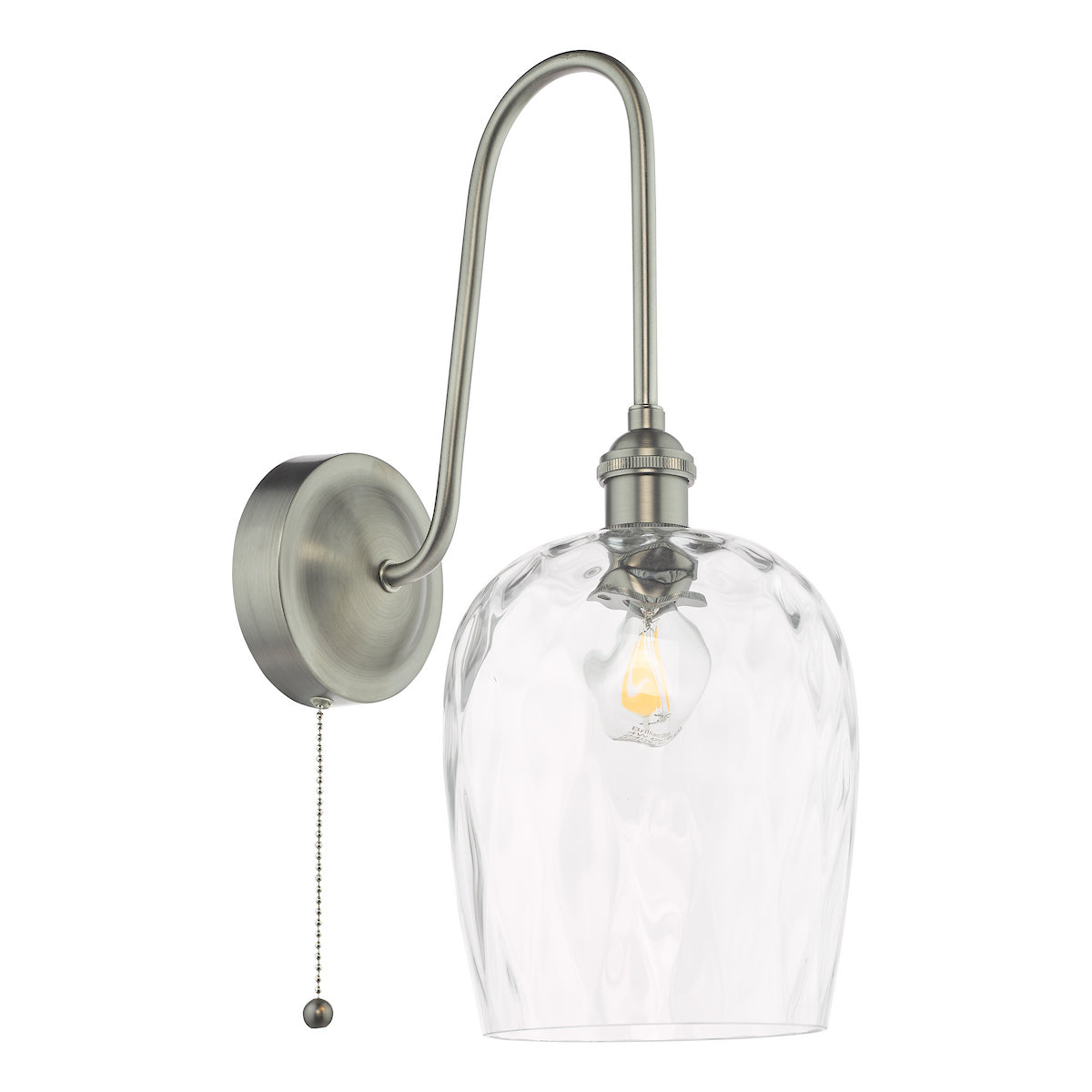 Brushed nickel wall sconce with a curved arm, clear textured glass shade, and pull chain switch. 