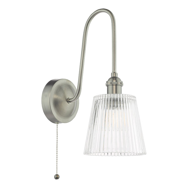 Brushed chrome wall light with a curved arm and a clear fluted glass shade, featuring a pull chain switch.