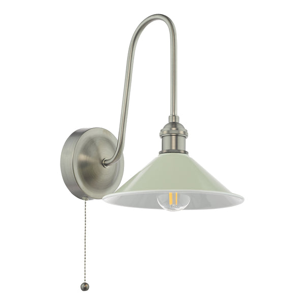 Brushed steel wall light with a curved arm, a pale green conical shade, and a pull chain switch.