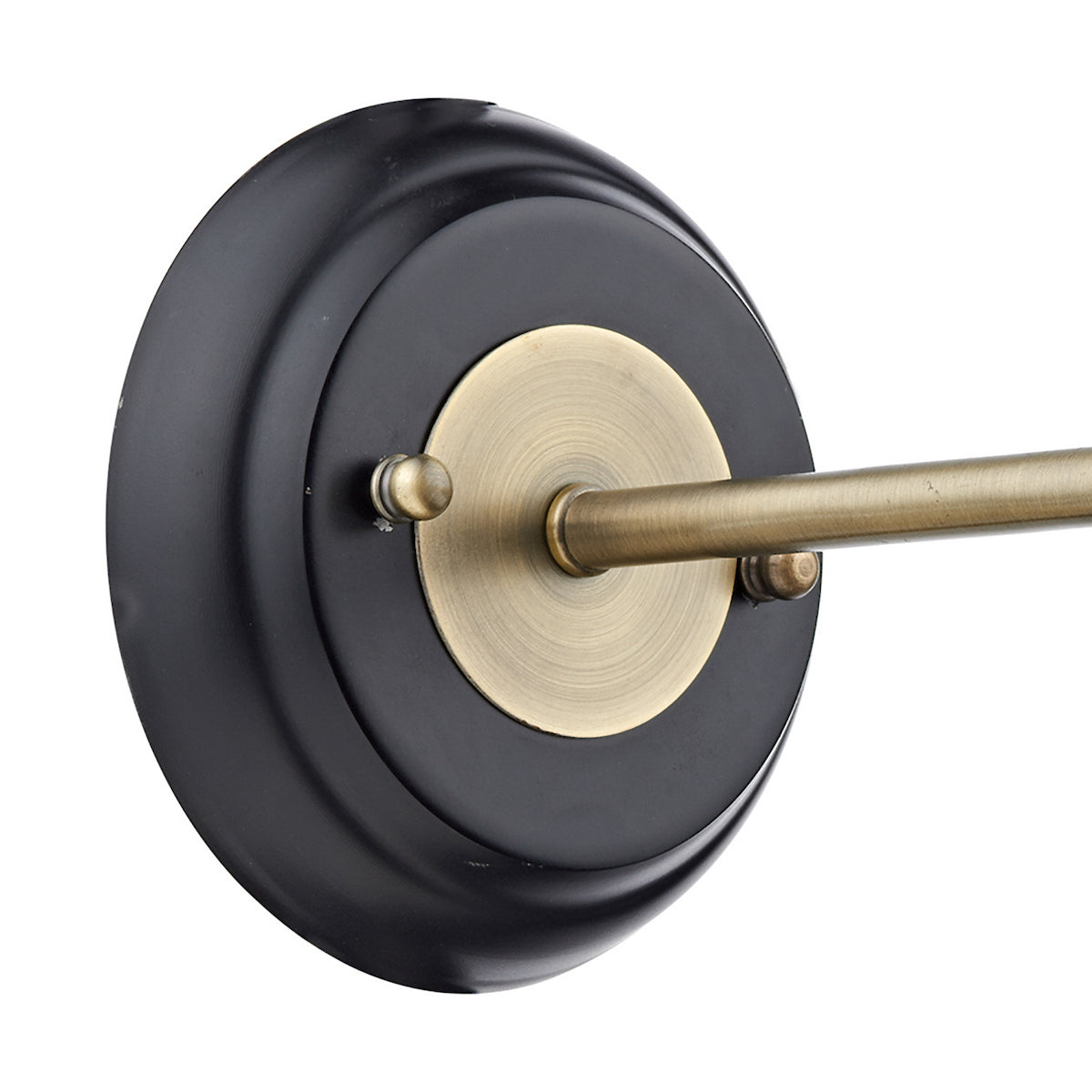 Close-up of a black and brass wall sconce base with a horizontal rod.