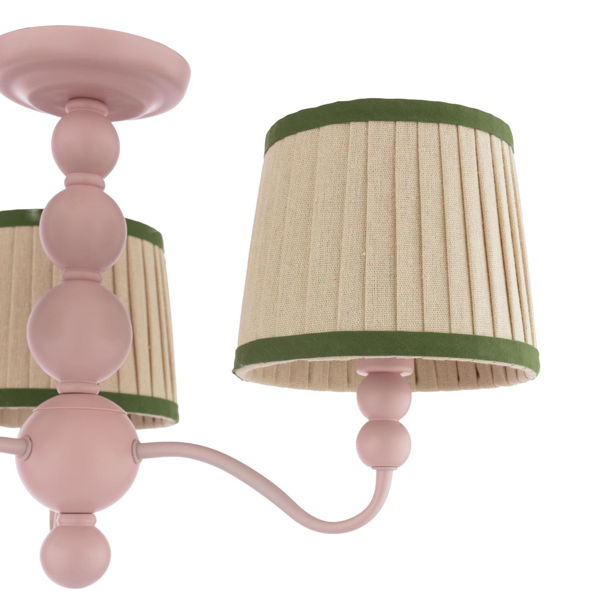 Pink chandelier with beige pleated fabric shades and green trim