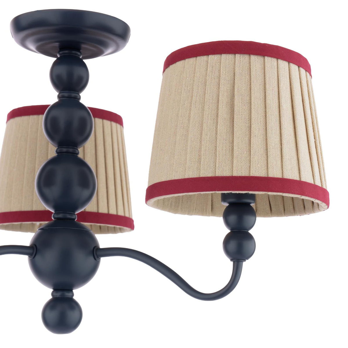 Black metal chandelier with beige pleated fabric shades and red trim