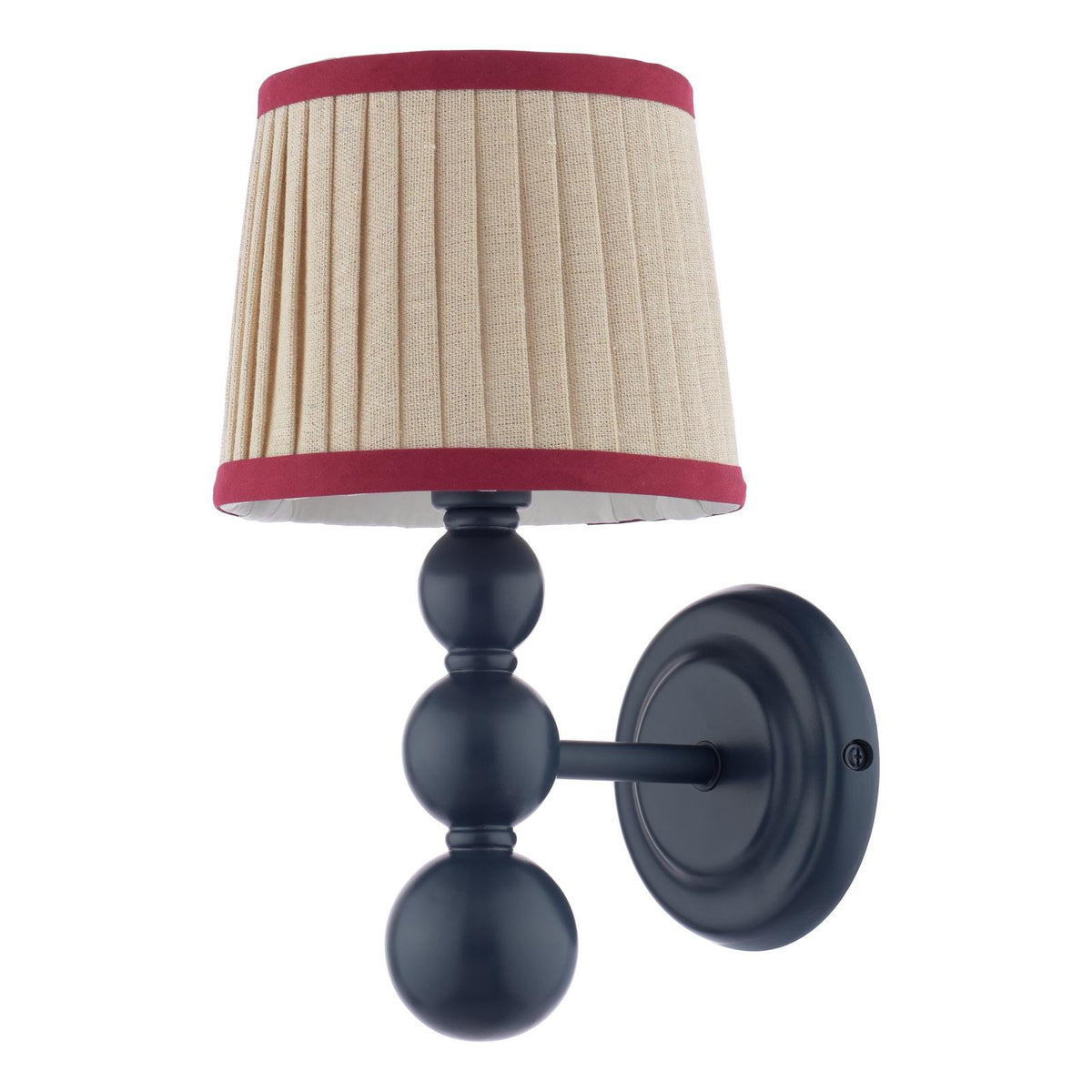 Wall sconce with a black stacked ball base and a pleated beige lampshade with red trim