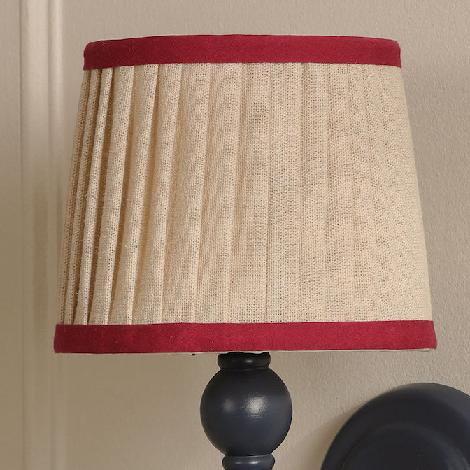 Joules Harewood wall light in matt blue with a pleated linen shade featuring red trim