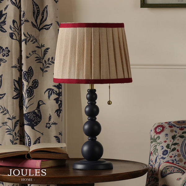 Joules Harewood table lamp in matt blue with a pleated linen shade and red trim