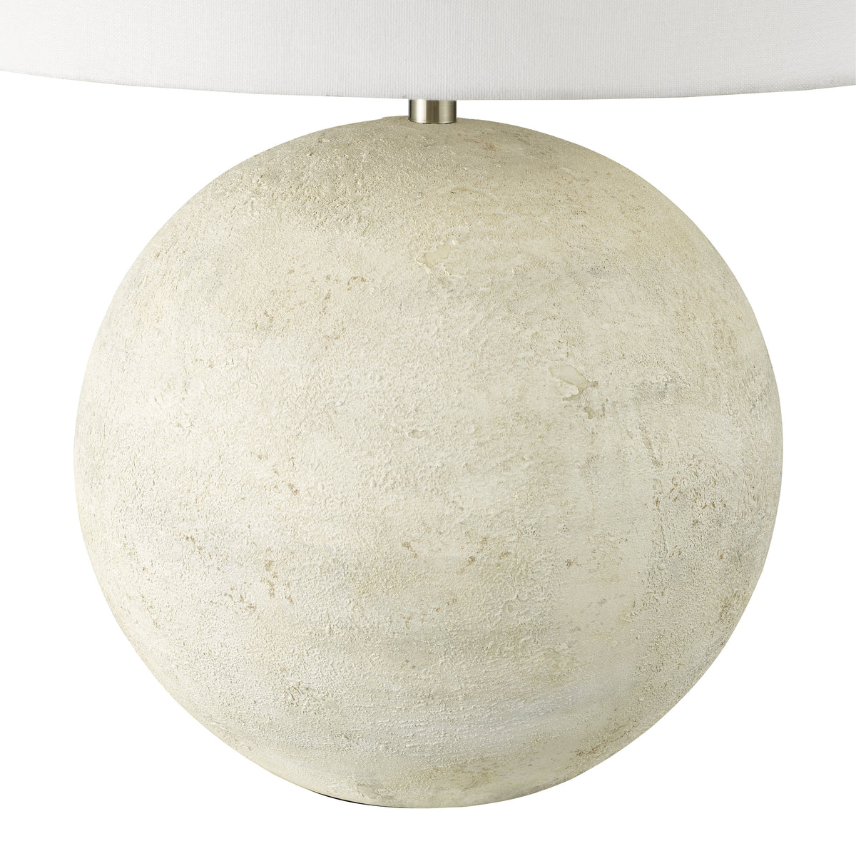Round table lamp with a textured beige base and a white fabric shade