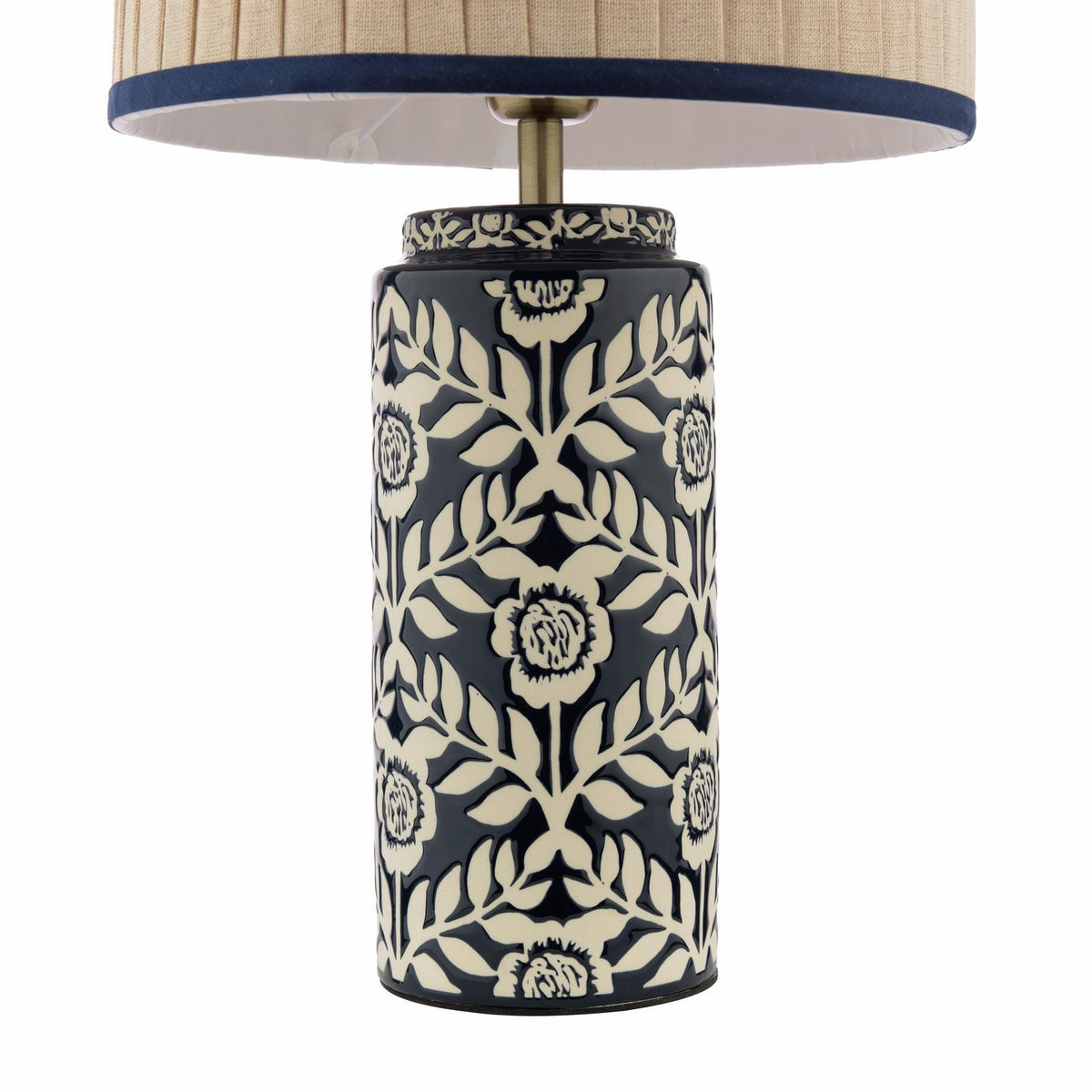 Table lamp with a cylindrical navy and cream floral ceramic base and a pleated fabric shade
