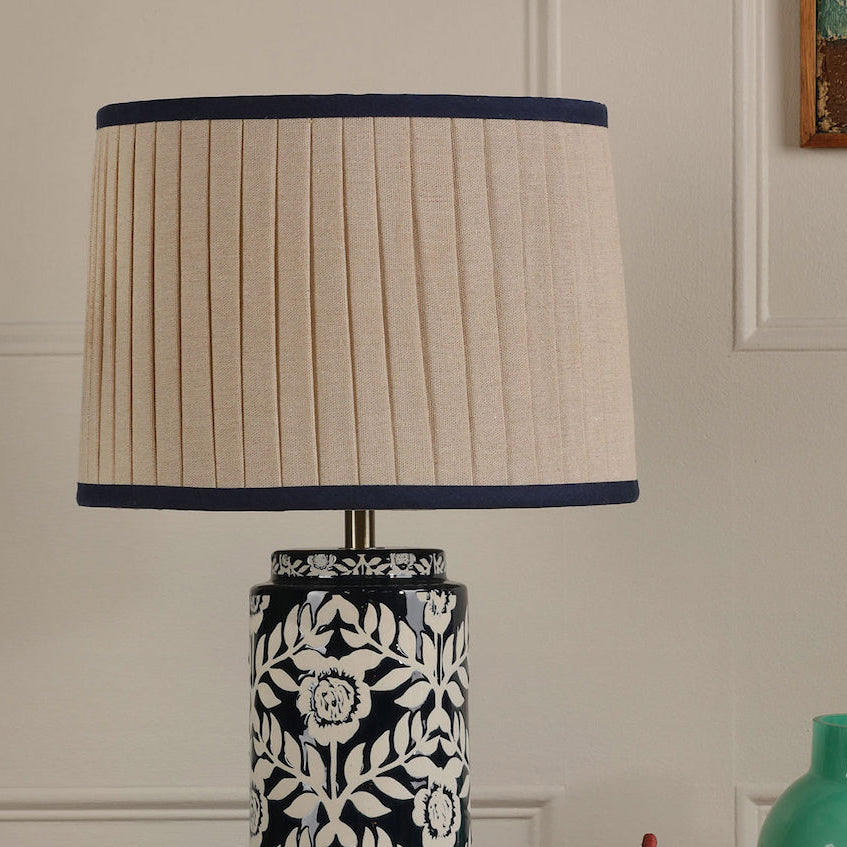 Joules Highclere ceramic table lamp in blue with a beige pleated linen shade