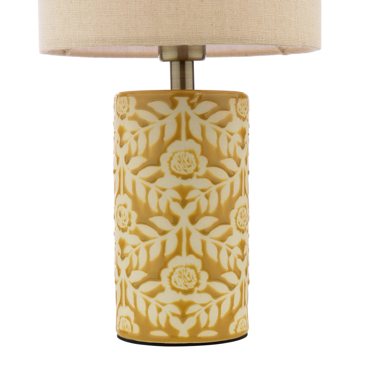Cylindrical table lamp with a yellow floral embossed ceramic base and a beige fabric drum shade