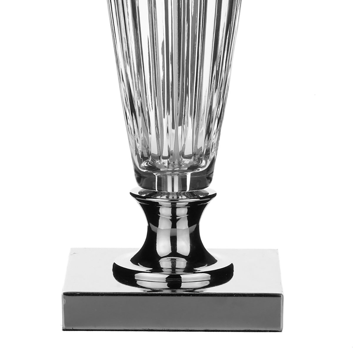 Close-up of a crystal lamp base with a square chrome stand.