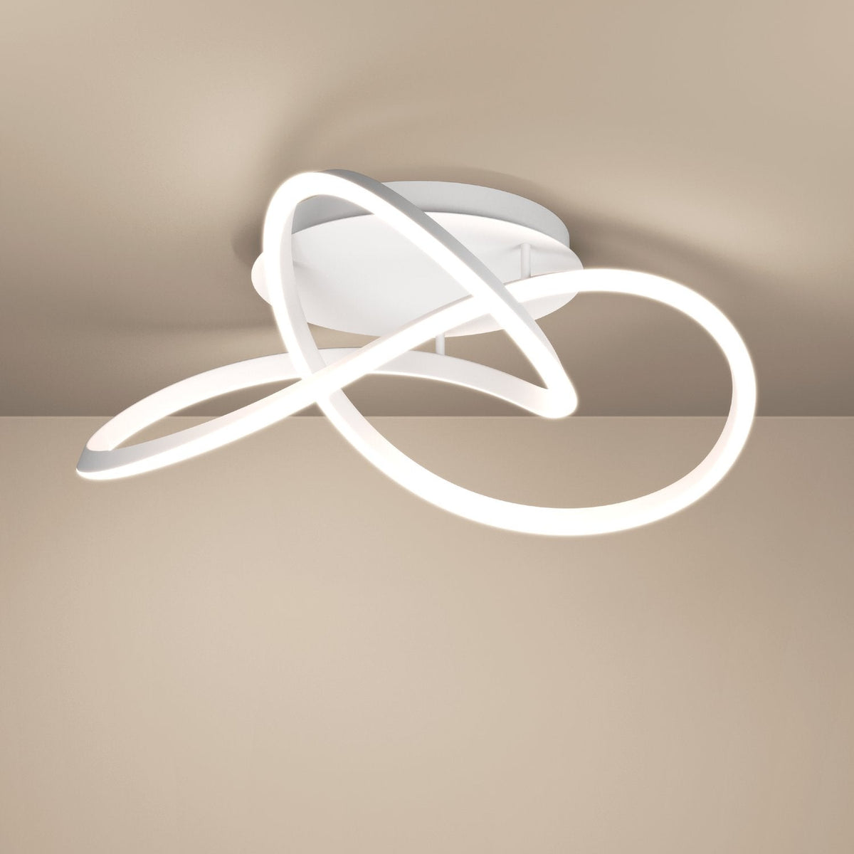 White ceiling light with a modern, abstract, and intertwined design
