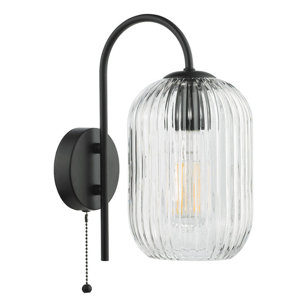 Black wall sconce with a curved arm and a ribbed clear glass shade, featuring an exposed filament bulb and a pull chain.