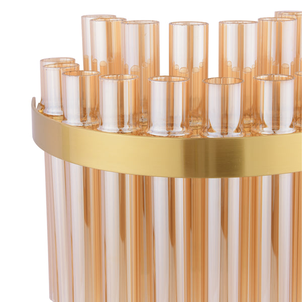 Close up of a gold and amber glass chandelier with vertical glass rods