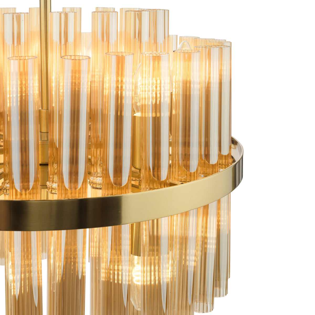 Close up of a gold chandelier with amber glass tubes