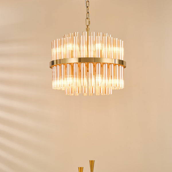 Round chandelier with two tiers of amber glass rods and a gold frame