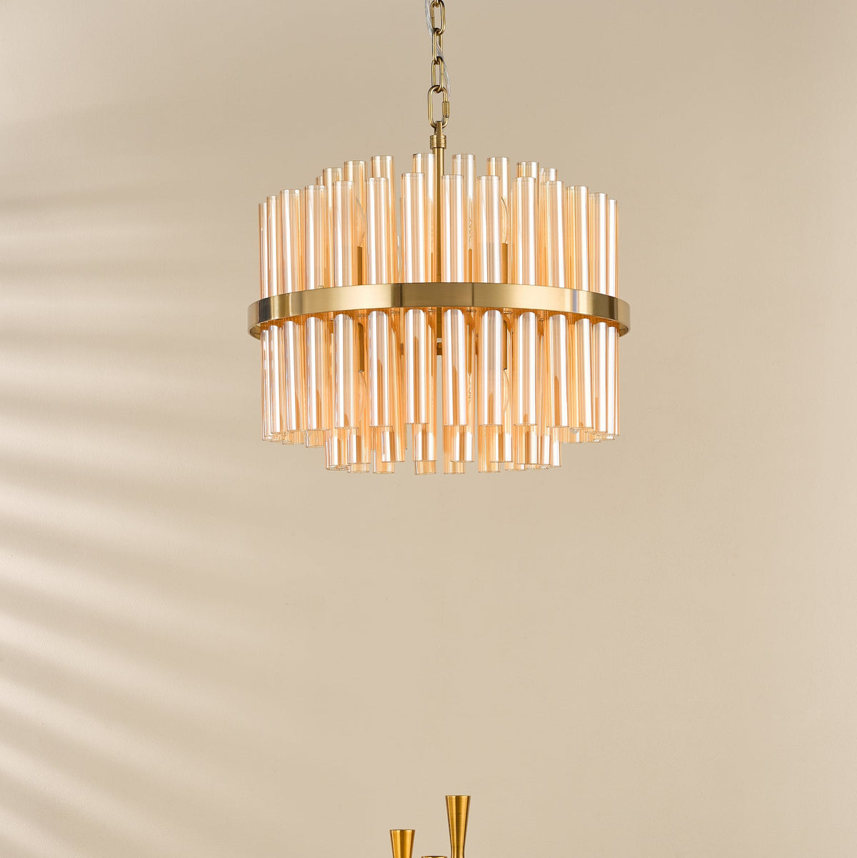 Gold chandelier with amber glass tubes