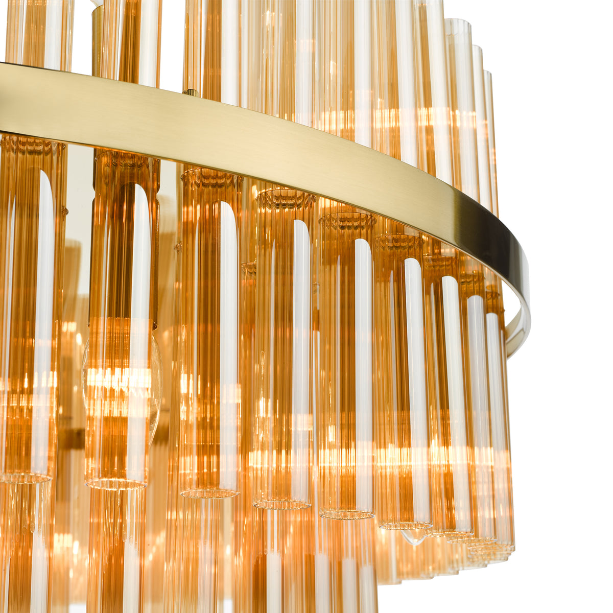 Close up of a gold chandelier with amber glass tubes