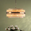 Imani Sixteen Light Pendant in Natural Brass with Champagne Ribbed Glass Rods