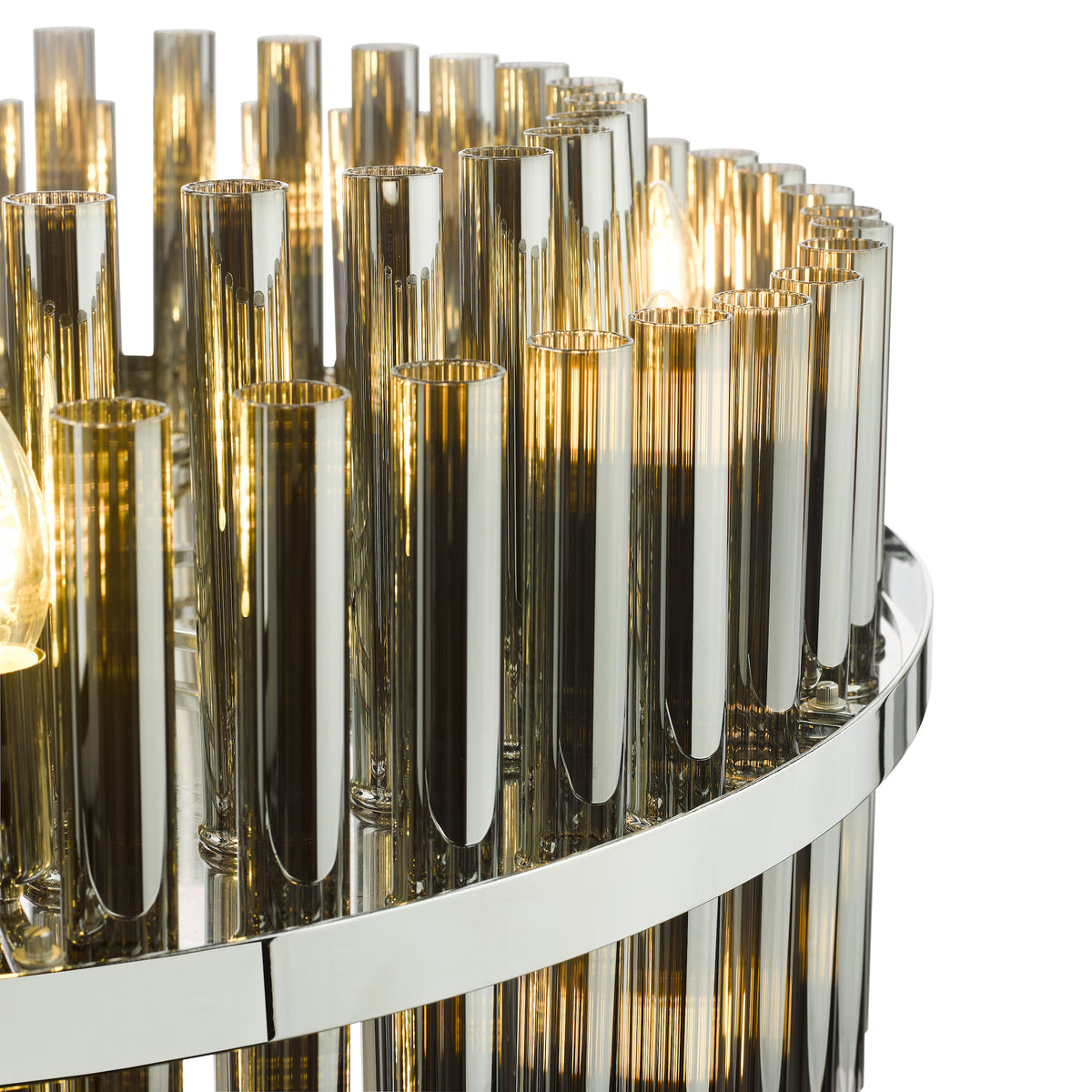 Close up of a chandelier with amber glass tubes and chrome accents