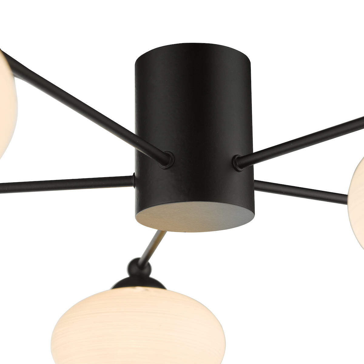 Close-up of a black ceiling light with multiple arms and white globe shades.