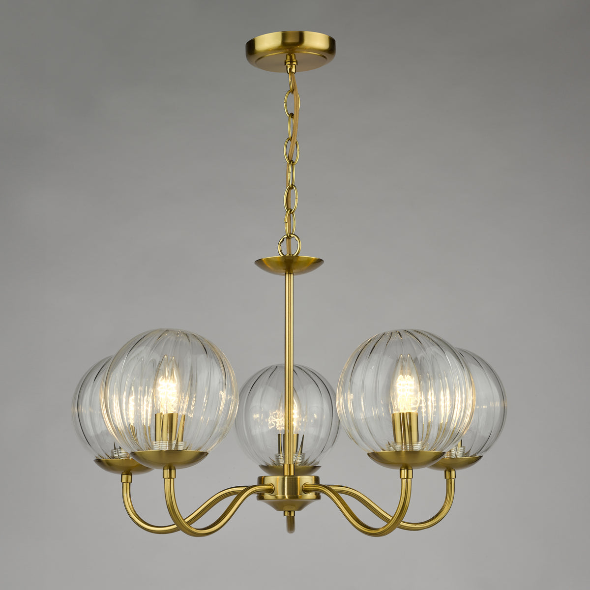 Brass chandelier with five ribbed glass globe shades