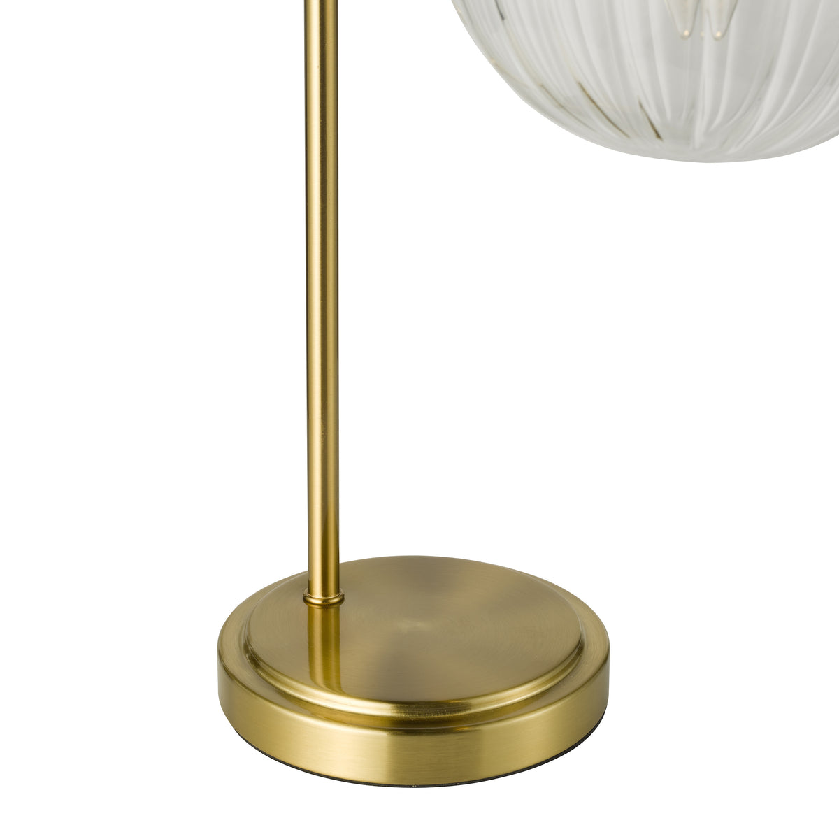 Close up of a gold lamp base and stem with a clear glass shade