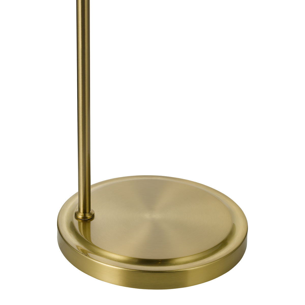 Round brushed brass base of a floor lamp with a vertical brass pole extending upwards